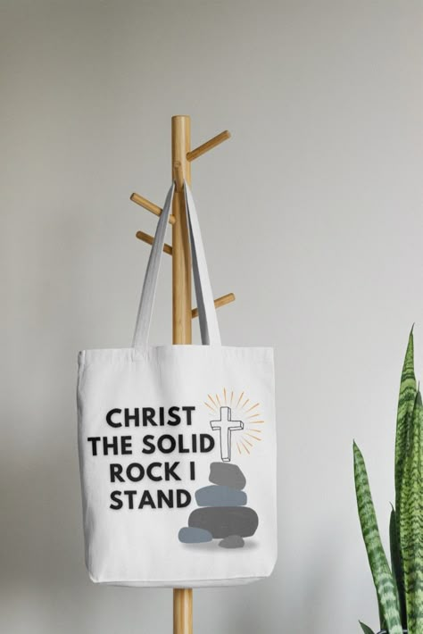 Rock and Cross Icon, Christian Quote, white typography Tote bag design saying, "Christ The Solid Rock I Stand." Christian Tote Bag Design, Tote Bag Christian, Cross Icon, Christian Graphic Design, Christian Tote Bags, Christian Merch, Gods Love Quotes, Custom Top, Christian Quote