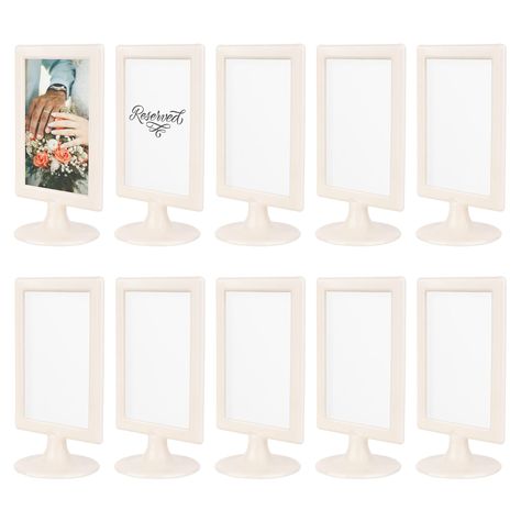 PRICES MAY VARY. Stylish & Versatile Decor - These double sided picture frames 4x6 are perfect for events & home décor. Showcase a variety of 4x6 photos in these standing frames. Ideal as table number frames for special occasions, the double sided frame allows you to easily swap images to match any theme. Transform any space with these elegant 2 sided frames, adding a touch of class and adaptability to suit any situation. Great for Business Establishments - These tabletop pedestal frames will el Standing Picture Frames, Double Sided Picture Frame, Plastic Picture Frames, Tabletop Picture Frames, Grad Party Decorations, 4x6 Picture Frames, Side Stand, 10 Count, White Picture Frames