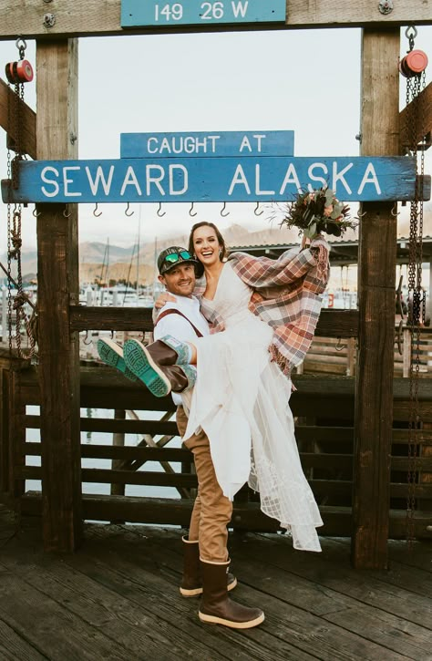 Gorgeous couple who just eloped in Seward, Alaska in front of the "Caught at Seward, Alaska" sign at the fishing harbor. #elopement Alaska Beach Wedding, Alaska Wedding Photos, Alaska Elopement Ideas, Alaska Wedding Dress, Alaska Wedding Ideas, Alaskan Elopement, Alaska Honeymoon, Travel To Alaska, Alaskan Wedding