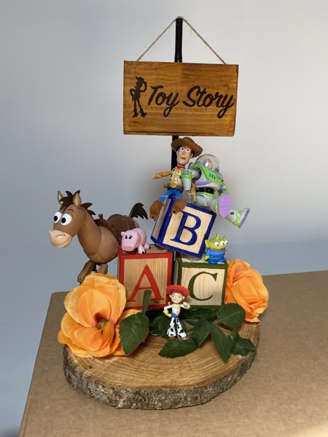 Disney Inspired Centerpieces, Toy Story Wedding Theme, Toy Story Wedding, Disney Themed Table Decorations, Disney Theme Centerpieces Diy, Disney Movie Centerpieces, Disney Themed Centerpieces, Disneyland Table Centerpiece, Disney Theme Centerpieces