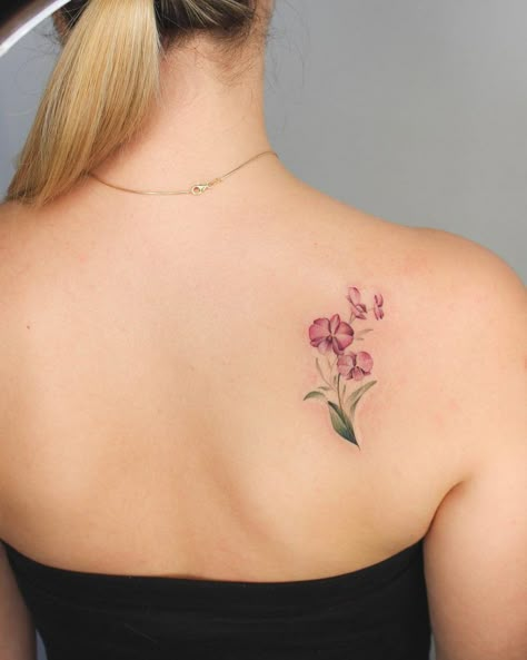 Orchids tattoo on the right shoulder blade - Tattoogrid.net Flower Tattoo Shoulder Blade, Flower Tattoos Back Shoulder, Tattoo Shoulder Blade, Scapula Tattoo, Orchid Flower Tattoos, Blade Tattoo, Shoulder Blade Tattoo, Orchid Tattoo, Flower Tattoo Meanings