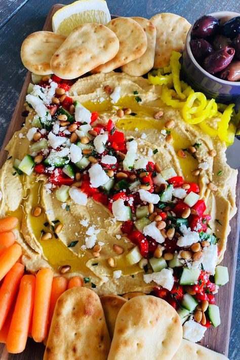 loaded hummus on a board Loaded Hummus Board, Hummus Board Charcuterie, Pita Charcuterie Board, Charcuterie Board Humus, Hummus Serving Ideas, Hummus Charcuterie Board, Hummus Board, Loaded Hummus, Hummus Platter