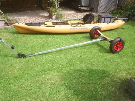 Here is one I made for my BGP out of a couple of nylon chopping boards and 4mts of 32mm ali box. It folds up and fits inside the front hatch!Knock the spots off a C-Tug and cost less too! Kayak Carts Diy, Homemade Kayak, Kayak Trolley, Camper Kayak Rack Diy, Kayak Car Rack, Rv Kayak Carrier Diy, Diy Kayak Rack For Truck, Kayak Ideas, Kayak Cart