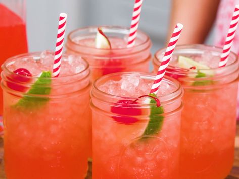 Homemade Cherry Limeade Recipe | I started making homemade cherry limeade for our annual Fourth of July party, and now it's become a special summer treat that I find myself making quite often. There's something about it that is quintessentially summer, and it's a childhood favorite that adults don't have to be ashamed to say they adore. Plus, it's great spiked with vodka for a cool cocktail. Mocktails Non Alcoholic Big Batch, Tailgating Drinks, Easter Punch Recipes, Tailgate Drinks, Cherry Limeade Recipe, Sonic Cherry Limeade, Christmas Drinks Alcohol Recipes, Limeade Recipe, Alcoholic Punch Recipes