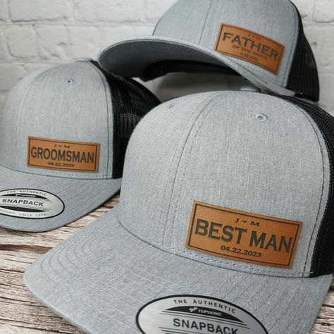 The absolute best BEST MAN hat with Bride and Groom initials and wedding date! BEST MAN patch on our Richardson 112 Trucker Hats. Nothing but the best for your Bride and Groom! You can choose Save the Date, GROOM, FATHER of the BRIDE, BEST MAN, GROOMSMAN or message us for custom requests.  We custom make each patch in Branson Missouri U.S.A. Contact us for special requests. We are here to make your wedding day spectacular! HOW TO ORDER - 1. Select your design. SAVE THE DATE - GROOM - BEST MAN - GROOMSMAN - FATHER OF THE BRIDE You can also message us with special requests. Examples: Names, Bride, Bridesmaid, Nicknames, etc. 2. Select your hat color.  3. Add Your Personalization - Enter the initials and the wedding date you would like on your hats. Please make sure your spelling is exactly h Groomsmen Hats Baseball Wedding Ideas, Wedding Hats For Groomsmen, Groom Baseball Hat Weddings, Groomsmen Hats Wedding, Groom In Hat, Bride And Groom Hats, Wedding Hats For Groom, Gifts For Groomsmen From Groom, Groomsmen Gifts Wedding Day