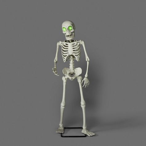 Spook your friends and family by adding this Animated Premium Skeleton Halloween Scene Prop from Hyde & EEK! Boutique™ to your Halloween decor. This fun and frightening Halloween prop showcases an animated human skeleton that has a light-up face with green glowing eyes. This electric-powered prop is suitable for sheltered outdoor use, so you can place it anywhere on your front porch or patio to welcome party guests or trick-or-treaters. Hyde & EEK! Boutique™: Thrilling delights. Curious oddities Animated Pumpkins, Posable Skeleton, Pirate Eye Patches, Trick Or Treat Studios, Glowing Eyes, Haunted Hotel, Halloween Prop, Human Skeleton, Target Gifts