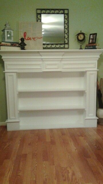 Reclaimed fireplace mantel and my husband repurposed it into a bookshelf! Fireplace Repurpose Ideas, Repurpose Fireplace Mantel, Mantel Bookshelf, Repurposed Fireplace, Unused Fireplace Ideas, Bookshelf Ideas Living Room, Reclaimed Fireplace Mantel, Unused Fireplace, Fireplace Bookcase