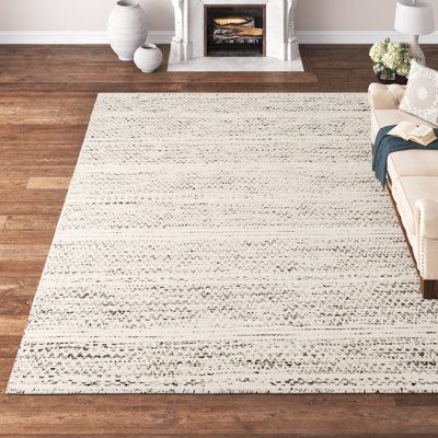 This area rug is a versatile addition to almost any room in your home. It has a medium pile height and no backing that make it flexible, a cinch to clean, and easy to slip under any door. Plus, it features a two-tone black and cream design that blends in with any colour palette and gives it a striped look. We recommend spot cleaning this rug, and shaking it out when it needs a clean. Hand-curated by Kelly Clarkson. | Kelly Clarkson Home Sylvie Chevron Handmade Flatweave Wool Cream/Black Area Rug Rugs For Dining Room Table, Bedroom Rugs Under Bed, Linen Couch, Coastal Dining, Kelly Clarkson Home, Neutral Area Rugs, Cream Design, Flatweave Area Rug, Cream Area Rug