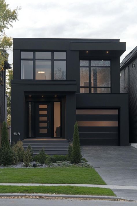 Modern black stucco house facade with bold architectural lines. Check out all of these sleek and stylish dark modern house ideas that blend sophistication with a touch of mystery. Modern Contemporary Exterior House Colors, Modern New Build House, 2 Story Contemporary House Exterior, Modern 3 Story House Exterior, Black Building Exterior, Concrete House Design Exterior, Black Stucco House, Black Stucco House Exterior, Modern House Design With Garage