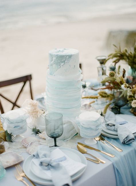 Blue White And Gold Beach Wedding, Blue Beach Wedding Aesthetic, Beach Luxury Wedding, Light Blue And Gold Wedding Decorations, Beach Wedding Light Blue, Boho Beach Wedding Table Decor, Ocean Blue Wedding Theme, Light Blue Beach Wedding, Ocean Theme Wedding