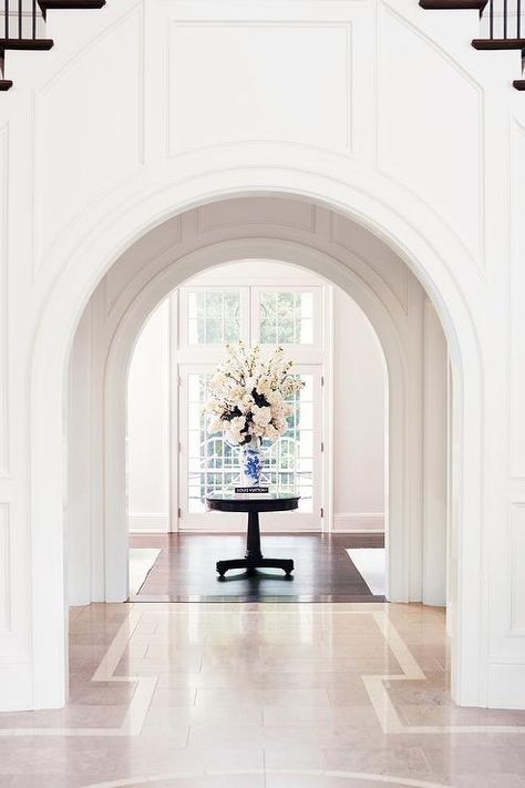 Arched Foyer Entryway, Wainscoting Arched Doorway, Wainscoting Around Arches, Cased Archway, Arch Wainscoting, Rounded Doorway, Round Doorway, Foyer Design Ideas, Arch Entryway