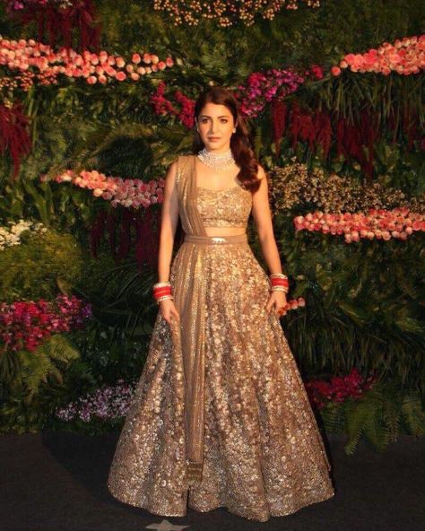 50 best pictures from Anushka Sharma and Virat Kohli’s Mumbai reception Golden Lehenga Brides, Golden Bridal Lehenga, भारतीय दुल्हन संबंधी, Golden Lehenga, डिजाइनर कपड़े, Mumbai Wedding, Reception Outfit, Sabyasachi Lehenga, Reception Lehenga