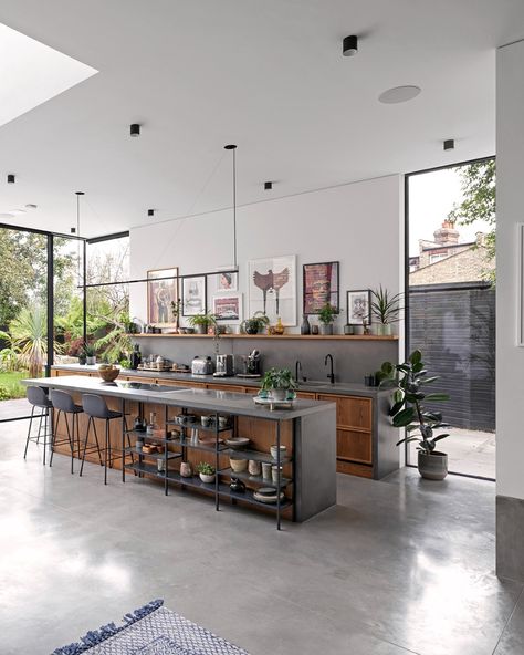 Welcome to Cloak House. Our kitchen worktop and island are the heart of this stunning space. All pre-cast in our factory, the worktop, island, splashback and end panels were all cast in our Platinum Grey colour to beautifully connect them with the polished concrete floor. The matching floor in Light Natural covers 100m2, inside and out. #InteriorDesign #ResidentialArchitecture #ConcreteFlooring Concrete And Wood Kitchen Island, Factory Kitchen Design, Grey Polished Concrete Floor, Poured Concrete Kitchen Floor, Polished Concrete Floor Kitchen Modern, Concrete Finish Kitchen, Polished Concrete Floor Interior Design, Concrete Floor Decor, Kitchens With Polished Concrete Floors