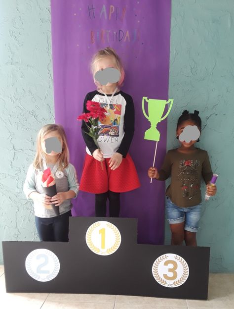 Olympic podium photo booth gymnastics party Olympic Podium Diy For Kids, Olympic Podium Diy, Olympics Dramatic Play, Olympics Trunk Or Treat, Diy Olympic Podium, Olympic Trunk Or Treat, Olympic Party Decorations, Gymnastics Theme Party, Vbs Olympics