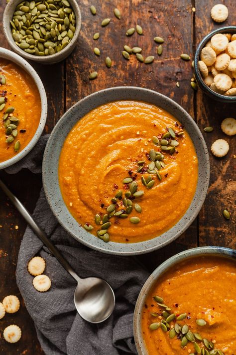 Vegan Pumpkin Bisque, Pumpkin Soup Photography Styling, Pumpkin Soup Photography, Homemade Soup Aesthetic, Pumpkin Soup Aesthetic, Autumn Food Photography, Soup Autumn, Vegan Pumpkin Soup Recipe, Pumpkin Cream Soup