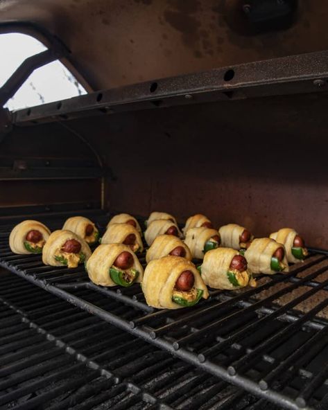 If jalapeño poppers and pigs in a blanket had a baby you would get these smoked jalapeño poppers pigs in a blanket! These cheese and bacon filled jalapenos, stuffed with a little smokie, wrapped in golden brown crescent dough, are hard to beat! Smoked Pigs In A Blanket, Smoked Jalapeno Poppers, Bacon Cracker, Bacon Wrapped Smokies, Dip Recipes Appetizers, Smoked Jalapeno, Cream Cheese Crescent Rolls, Jalapeño Poppers, Bbq Seasoning