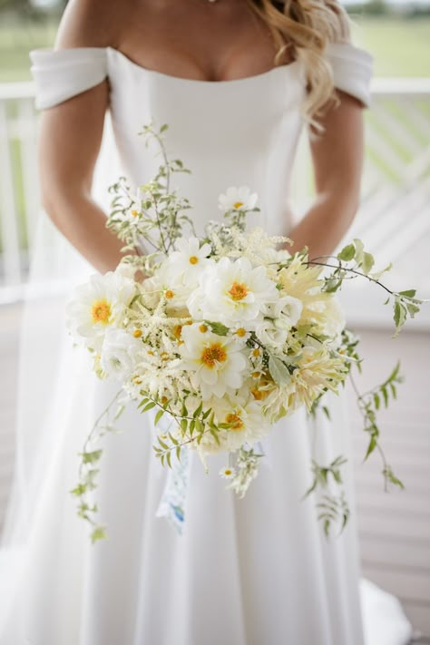 Luscious White and Yellow Bride Bouquet With Pops of Color and Cascading Greenery   #whiteandyellowbouquet #whitebouquet #yellowbouquet #wildflowerbouquet #lushbouquet Yellow Bride Bouquet, Pale Yellow Weddings, Yellow Bride, Daffodil Wedding, Whimsical Bouquet, Yellow Bridal Bouquets, Yellow Wedding Bouquet, Yellow Wedding Theme, Yellow Wedding Flowers