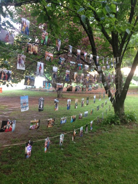 Pictures Hanging From Trees, Photos Hanging From Tree, Photo Wall Party Decoration, Picture Wall Birthday Party, Picture Wall Ideas For Party, Pictures Hanging On String, Family Reunion Photos, Hang Photos, Backyard Graduation Party