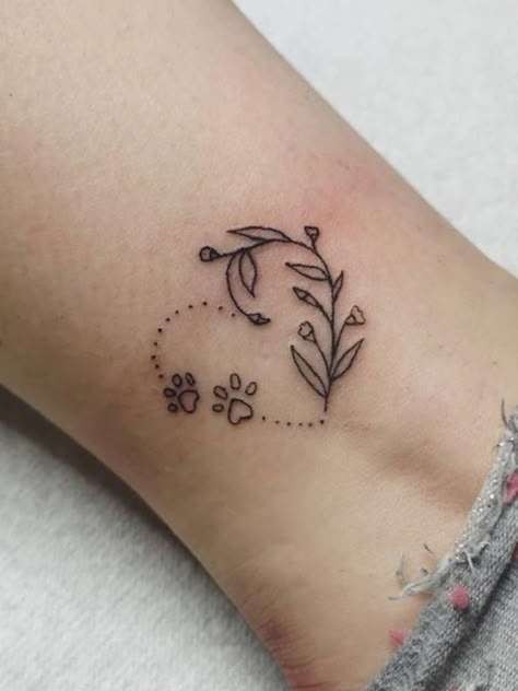 Simple Tattoos For Dogs That Passed, Unique Dog Tattoo Ideas For Women, Dog Tribute Tattoo Small Flower, Dog Ankle Tattoo, Butterfly Dog Tattoo, Tattoo Ideas For Passed Dogs, Paw Tattoo Ankle, Fine Line Dog Paw Print Tattoo, 2 Dog Tattoo Ideas