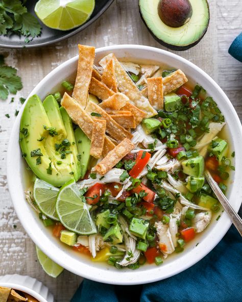 An easy crockpot soup that's full of Mexican flare! It's loaded with shredded chicken, creamy avocado, cilantro, lots of lime and best served with crispy tortilla strips on top! It's the perfect cozy weeknight meal! Chicken Cilantro Lime Soup, Chicken Avocado Tortilla Soup, Mexican Chicken Lime Soup, Chicken Lime Tortilla Soup, Cilantro Lime Soup, Chicken Avocado Lime Soup, Avocado Lime Soup, Cilantro Soup, Chicken Lime Soup