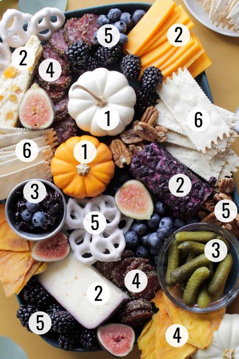 Learn how to build a fall charcuterie board with a shopping list of the best Trader Joe’s items of the season! This elegant cheese board is perfect for the fall season, including on game day, as a Thanksgiving appetizer platter, or even for an easy happy hour appetizer. Although the aesthetic of this charcuterie board is bright and beautiful, it is actually simple to make! With the help of a video, I’ll show you how to make this fall charcuterie board with all my helpful tips & tricks! Charcuterie Board List Trader Joes, Thanksgiving Easy Charcuterie Board, Trader Joes Fall Charcuterie Board, Office Charcuterie Board, Fig Charcuterie Board, Thanksgiving Charcuterie Board Ideas Simple, Fall Charcuterie Boards, Thanksgiving Food Board, Easy Thanksgiving Charcuterie Board