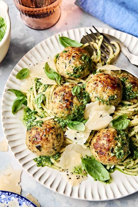 Baked Pesto Meatballs loaded with the vibrant flavors of classic Italian pesto! Made with your choice of ground chicken or turkey, they’re packed with fresh basil, garlic, parmesan, & pine nuts for a bold punch of pesto flavor—and no extra oil needed! Oven-bake, then broil for no-fuss tender, & juicy meatballs—just as good as pan-fried, minus the mess! #pestomeatballs #turkeypestomeatballs #chickenpestomeatballs #chickenmeatball #turkeymeatball #meatballrecipes #italianrecipes #dinnerideas Pesto Chicken Meatballs, Turkey Meatballs Paleo, Pesto Dinner, Turkey Pesto Meatballs, Meatballs Turkey, Pesto Meatballs, Italian Pesto, Juicy Meatballs, Grain Brain