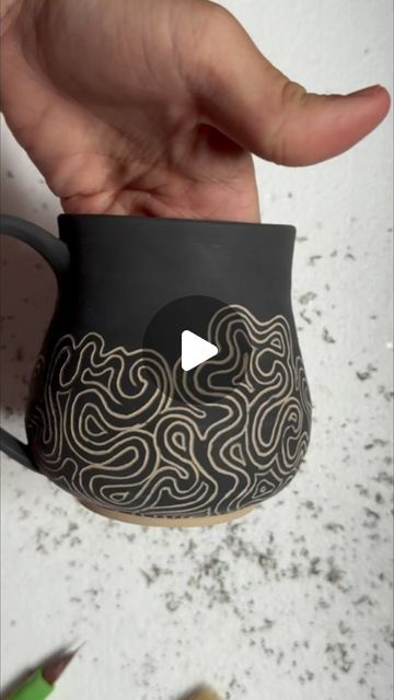 Pottery by Rachel Orrino on Instagram: "More of those swirly underglaze carves 💫🌀  #pottery #wheelthrownpottery #homeade #mug #mugshotmonday #potteryofinstagram #velvetunderglaze #amacovelvetunderglaze #diamondcoretools #diamondcore #black #sgraffito" Pottery Sgraffito Ideas, Scrifito Pottery, Sgraffito Ceramics, Sgraffito Designs, Carving Clay, Creative Pottery, Pottery Slip, High School Ceramics, Sgraffito Pottery