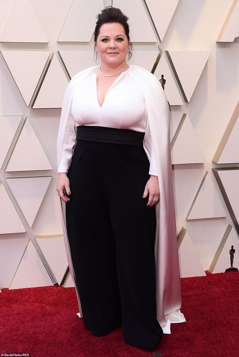 Fancy: Melissa McCarthy looked incredible in her black and white jumpsuit with a cape detail Red Carpet Dress Plus Size, 2019 Red Carpet, Vintage Reference, Melissa Mccarthy, The Oscars, White Jumpsuit, Old Hollywood Glamour, On The Red Carpet, Academy Awards