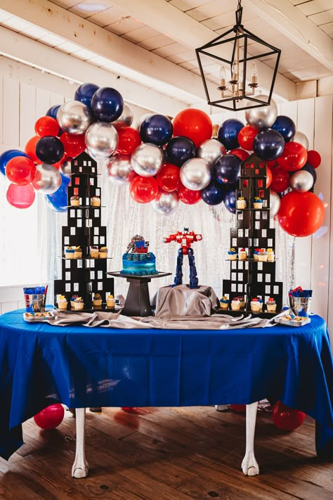 Transformers Balloon Decorations, Rescue Bot Birthday Party, Rescue Bots Birthday Party Decorations, Transformers Dessert Table, Transformers Decorations Party, Optimus Prime Party Decorations, Gundam Birthday Party Ideas, Transformers Birthday Party Decorations, Transformers Balloon Garland