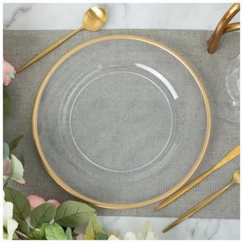 Diameter: 13" Material: Plastic Color: Clear & Gold Care & Safety: Not Intended For Food Use Quantity: 1 Create a unique and dynamic table setting when you use this Charger Plate With Gold Rim. This clear charger plate has a shallow well in the center with a metallic gold rim around the outer edge. Use this piece as a decorative base for your dinner plate and coordinate with matching tableware for an elegant arrangement.   *No discounts may be applied to "your price" or "reduced" items. Gold And Silver Charger Plates, Dark Green Charger Plates, Clear Plates With Gold Trim, Gold Rimmed Charger Plates, Clear Chargers With Gold Trim, Wedding Plates And Silverware, Silver Thanksgiving Table Decor, Thanksgiving Table Settings Elegant Gold, Sage And Gold Table Setting