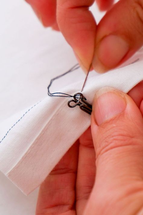 If you are new to sewing on hook & eye fasteners or have done it before and need a refresher, read on. We’ll explain how to place hook-and-eye fasteners correctly. You attach them with hand sewing. There are different ways to attach hook and eye closures. The following method is our preferred method. It is a sturdy way and has a very clean finish. It works the same for different sizes and models of hook & eye closures. Sew Hook And Eye, Sewing Hooks And Eyes, How To Sew Hook And Eye, Hook And Eye Closure Sewing, Eye Tape, Bias Tape Maker, Seam Guide, Seam Rippers, Quilting Frames