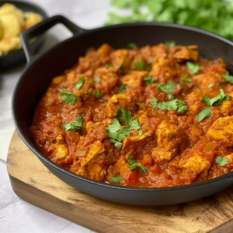 Chicken bhuna is a spicy and flavourful dish that is definitely worth trying for Indian cuisine lovers. A classic Indian chicken curry made with boneless chicken, onions, tomatoes, and an array of spices. ‘Bhuna’ is the term for fried. In this case, it refers to the chicken being cooked in the onion and tomato masala. […] The post Chicken Bhuna appeared first on Scrumptiously. Chicken Bhuna Masala, Chicken Bhuna Recipe, Bhuna Chicken Recipe, Chicken Bhuna, Chicken Breast Curry, Chicken Madras, Easy Supper Recipes, Indian Chicken Curry, Chicken Recipes Video