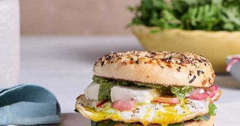 Goat Cheese Pesto Bagel Sandwich Pesto Bagel, Goat Cheese Pesto, Egg Breakfast Sandwich, Prosciutto Sandwich, Fried Egg Breakfast, Jalapeno Chili, Egg Sandwich Breakfast, Cheese Log, Quick Pickled Onions