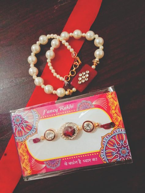 Pearl Bracelet along with kundan rakhi. Pearl Bracelet, Charm Bracelet