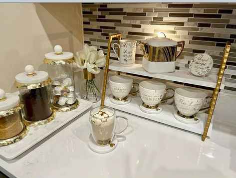 Immerse in the luxurious blend of luxury and coffee in your stylish coffee bar retreat. Coffee Bar Ideas White And Gold, Gold Coffee Station Ideas, White And Gold Coffee Station, Gold Coffee Bar Ideas, Gold Kitchen Decor Ideas, Glam Coffee Bar Ideas, Luxury Coffee Bar, Gold Coffee Bar, Tea Corner Ideas