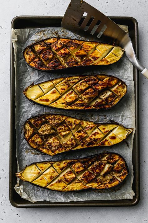 These oven-roasted eggplant (aubergine) halves are paired with a delicious chermoula sauce and a drizzle of honey. It’s a simple vegetable side dish recipe that’s packed with both sweet and savoury flavours! Recipe is vegetarian, gluten-free, and dairy-free. Roasted Eggplant Halves, Oven Roasted Eggplant, Chermoula Sauce, Vegetable Side Dish, Vegetable Side Dishes Recipes, Roasted Eggplant, Roast Eggplant, Vegetable Side, Healthy Side