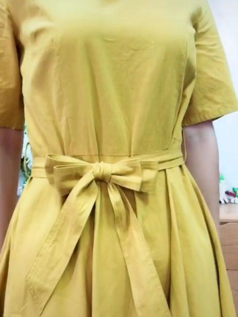 How to Tie a Bow Step by Step [Video] | Diy belt for dresses, Fashion hacks clothes, Refashion clothes How To Tie A Frock Knot, Diy Ribbon Belt For Dress, Tie Ribbon Dress, How To Tie Knots In Dresses, How To Tie Ribbon On Clothes, Bow Belt Tutorial, How To Tie A Ribbon On A Dress, How To Tie A Bow With Ribbon On A Dress, Dress Bow Tutorial