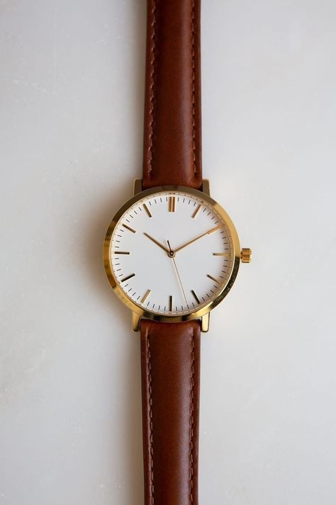 This is Unisex Watch. This 36mm watch is recommended for men that prefer smaller watches. For women, this is a classic medium size case. ✦ Case Size: 36mm ✦ Case Material: Gold Tone Stainless Steel ✦ Japanese Quartz Movement ✦ Mineral Glass ✦ Analog Display ✦ Strap: Cognac Brown Genuine Leather ✦ Strap Width: 16mm ✦ 3 ATM Water Resistance (protected from splashes such as hand washing, rain but must not be worn while bathing, swimming or diving) Cognac Brown Leather Minimalist Watch, Brown Minima Brown Watches Women, Classic Watch Women, Brown Minimalist, Pretty Watches, Watch Womens, Classy Watch, Trendy Watches, Simple Watches, Vintage Watches Women