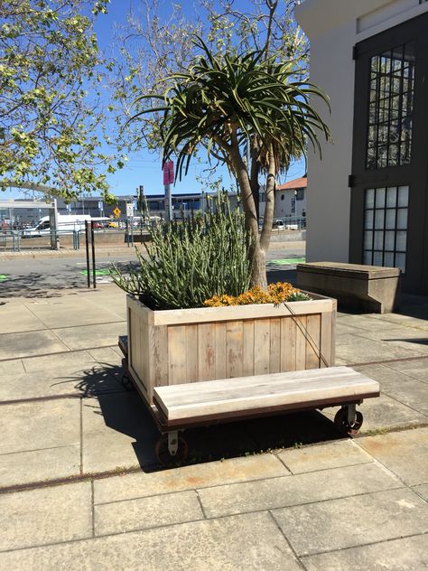 Movable planter/bench in San Francisco Planter With Seating, Moveable Planters, Seating Planter, Movable Planter, Urban Bench Design, Movable Furniture, City Bench Design, Mobile Furniture, Planter Bench