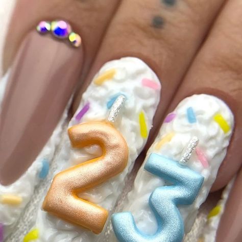 Kellina 🖤 NAIL ARTIST 🖤 on Instagram: "here's to 23 🧁🤍  thank you all for your birthday wishes yesterday 🥹 it meant so much to me 🫶🏼 & thank you @ange1ina.kay & @itsmikbihhh for such an amazing weekend. it was definitely one for the books 😌🖤   i used all @nailzbydevshop products to create this look 🧁 you can use code : KELLS to save! 🤍   🎂 xl full cover tapered square quickie tipz  🎂xxl stiletto full cover tips  🎂sugar cookie  🎂white out  🎂so juicy  🎂be my lover  🎂multiple colored trippy gels  🎂shiny top coat  🎂12 mm dream liner   #nailzbydevshop #nails #nailart #nailsofinstagram #pressonnails #gelx #birthdaynails #leo #leoseason #birthdaycake #summernails #23" Birthday Candle Nails, Cake Nails Design, Birthday Cake Nails Design, Frosting Nails, Nails With Names On Them, 23 Birthday Nails, Uwu Nails, Happy Birthday Nails, Fun Birthday Nails