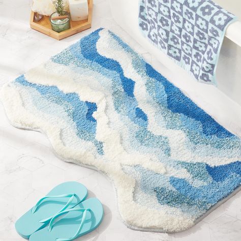 PRICES MAY VARY. 🌊 𝗥𝗶𝗱𝗲 𝘁𝗵𝗲 𝗪𝗮𝘃𝗲𝘀 𝗮𝘁 𝗛𝗼𝗺𝗲! Ever Miss the Beach in Winter? If you find yourself yearning for summer vibes in the cold, our ocean wave rug is the perfect remedy. A must-have for every beach lover—because who says the beach is just a summer affair? 💙 𝗕𝗲𝘆𝗼𝗻𝗱 𝗦𝗼𝗳𝘁𝗻𝗲𝘀𝘀 𝗮𝗻𝗱 𝗔𝗯𝘀𝗼𝗿𝗽𝘁𝗶𝗼𝗻: Immerse yourself in the velvety luxury of this cute bath mat! Crafted from high-density microfiber with an impressive 1000gsm tuft, it guarantees unparallele Decor Baie, Bedside Rug, Plush Area Rugs, Have Inspiration, Bath Mat Rug, Patterned Carpet, Blue Waves, Bedroom Carpet, Carpet Flooring