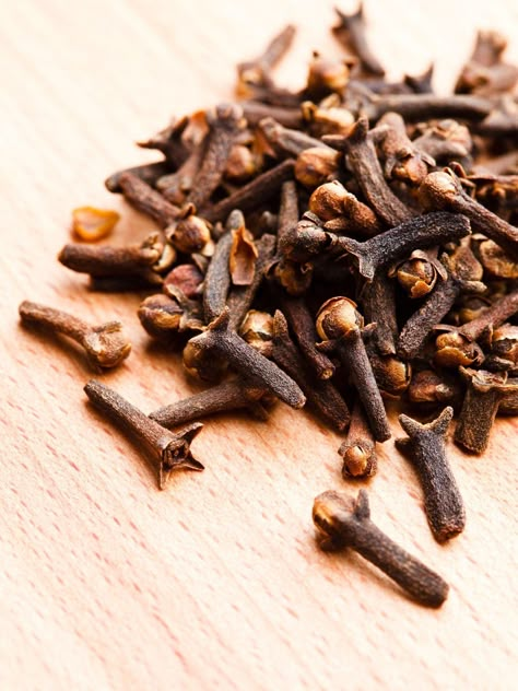 Clove has a sharp, warm and spicy aroma that can be reminiscent of the holidays. Clove essential oil has a warming and comforting effect on the senses. It is an aphrodisiac in nature and therefore serves as an excellent stress reliever. If you have feelings of fatigue, clove aids in improving concentration. It has a stimulating effect on the mind and removes mental exhaustion, making clove a great essential oil to help get the mind and body moving. Clove may also support respiratory health due t Clove Plant, Grow Long Nails, Spices Photography, Nasal Inhaler, Cloves Spice, Natural Decongestant, Design Garden Ideas, Healthy Life Hacks, Beverage Photography