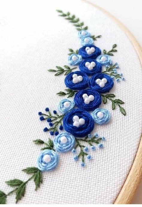 Emboridary Designs Flower, White Embroidery On Blue Fabric, Emboridary Designs, Beautiful Embroidery Designs, Embroidery On Sky Blue Fabric, Blue Rose Embroidery, Blue Flower Embroidery Pattern, Blue And Purple Flower Embroidery, Modern Hand Embroidery Patterns