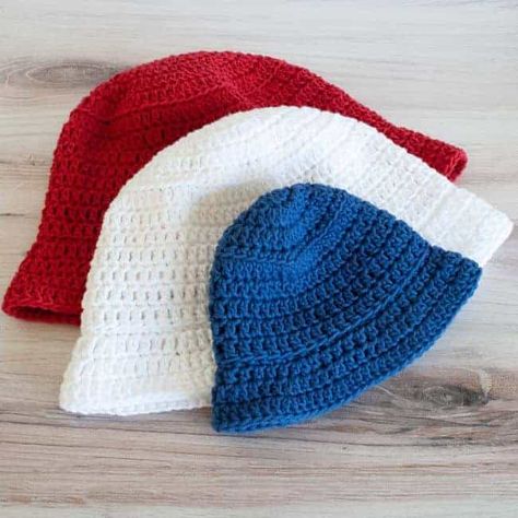 Whip up a quick crochet bucket hat with this free pattern! Grab some worsted weight yarn and make this hat that comes in eight sizes from baby to adult. Worsted weight 100% cotton like WeCrochet/KnitPicks Dishie works great for a breathable hat. Or try other fibers too. Make a bunch for the whole family in a variety of colors. This quick project can be made in an evening or a weekend. Free Crochet Patterns For Hats For Kids, Easy Bucket Hat Pattern, Kids Crochet Hat Patterns, Crochet Toddler Bucket Hat Free Pattern, Double Crochet Bucket Hat, Crochet Bucket Hat Kids, Bucket Crochet Hat Patterns, Children’s Crochet Hat Patterns, Free Crochet Pattern For Bucket Hat