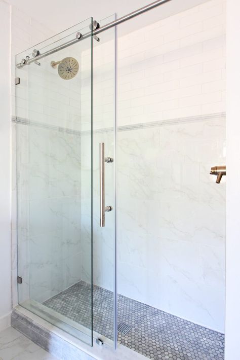 Shower head on the opposite wall of the faucet controls so you don't get wet when you turn on your shower. Two Shower Heads, Classic Bathrooms, Marble Chair, Bathroom Finishes, Delta Champagne Bronze, Tile Showers, Very Small Bathroom, Small Shower, Bathroom Showers