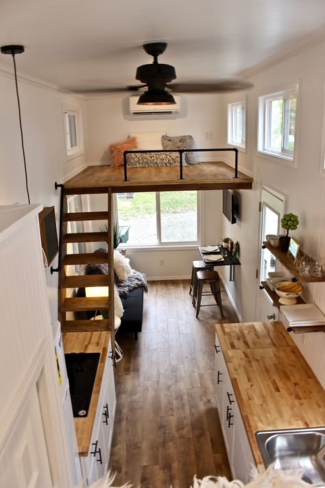 To the right of the entryway is the living room with an L-shaped IKEA sofa sleeper, IKEA fold up table, 32" flat screen TV, and ceiling fan. Above the living room is a 6.5'x7.5' bedroom loft with stairway access. Scale Loft, Design Casa Piccola, Apartemen Studio, Tiny House Interior Design, Tiny House Loft, House Loft, Best Tiny House, Interior Design Per La Casa, Trendy Living Rooms