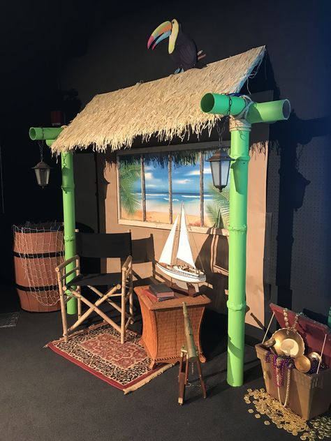 2018 Shipwrecked VBS stage decorations - my diy tiki hut, treasure chest from a foam cooler and “wooden” barrel from a cardboard box. How To Make A Tiki Hut, Diy Stage Decor, Canopy Cafe Vbs, Thunder Island Vbs Decorations, Jungle Hut Diy, Diy Tiki Hut For Party, Hut Decoration Ideas, Tiki Hut Decorations, Tiki Boxes Diy