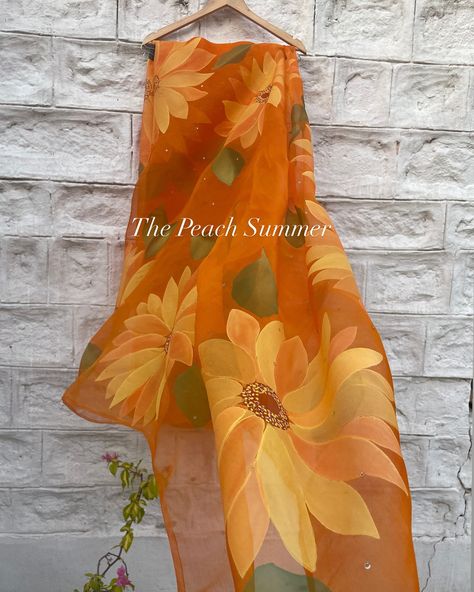 The Sunflower Saree _______________________________________________ Elevate your style with our stunning hand-painted sunflower saree! Made from luxurious pure silk organza in vibrant orange, this saree is adorned with golden sequins for an extra touch of glamour. Stand out from the crowd and make a statement wherever you go! Shop now and shine bright like the sunflower you are! . . . . . . Shop Now @thepeachsummer . . . . . . #thepeachsummer #thepeachsummercollection #thepeachsummerclie... Sunflower Saree, Hand Painted Organza Sarees, Artistic Hand Painted Saree For Festive Occasions, Festive Artistic Hand Painted Saree, Yellow Hand Painted Saree, Hand Painted Sarees, The Sunflower, Stand Out From The Crowd, Painted Clothes