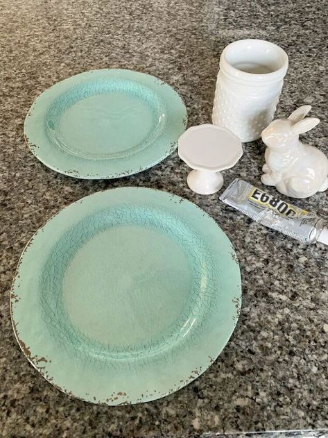 Here is an easy craft project that you can make in a matter of minutes. Let’s make a DIY Spring Tiered Plate Stand.You have seen the expense tiered tray with the fancy dishes. Let’s make our own DIY at a fraction of the cost. Look for items you have already on hand. Like miss matched dishes ceramic or plastic. Candle stick holders, small vases, glasses, cups, etc. will all work.Go to your local thrift stores for some of these items or yards sales. Just use your imagination.I decided to… Diy Outdoor Candles, Aging Terra Cotta Pots, Diy Candle Sticks, Small Cupcakes, Fancy Dishes, Wood Cake Stand, Small Vases, Candle Stick Holders, Diy Spring Wreath