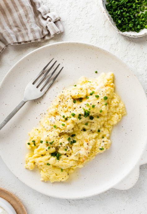 These cottage cheese scrambled eggs are a great way to switch up your morning breakfast! They're super easy to make and result in fluffy, creamy eggs that are high in protein. Cottage Cheese Scrambled Eggs, Cheese Scrambled Eggs, Blueberry Yogurt Muffins, Scrambled Eggs With Cheese, Cottage Cheese Eggs, Eating Bird Food, Creamy Eggs, Bacon Sausage, Cottage Cheese Recipes